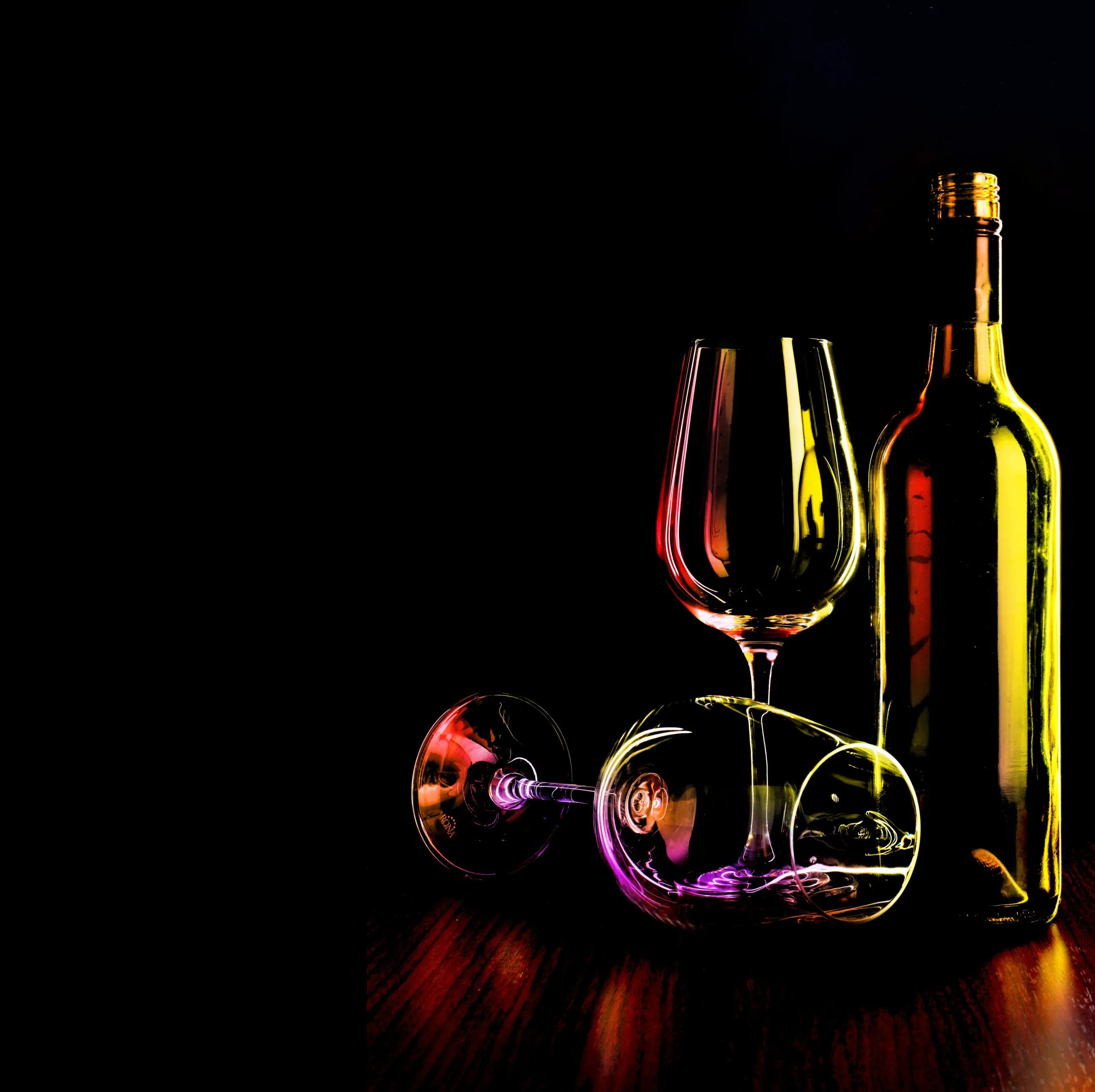 Elegance in Darkness - Wine glasses and bottle captured in a serene composition