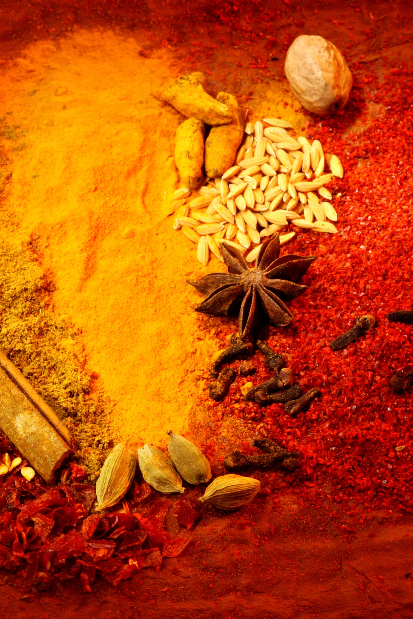 roduct photography course student flat lay project featuring colorful spices, turmeric powder, and star anise.